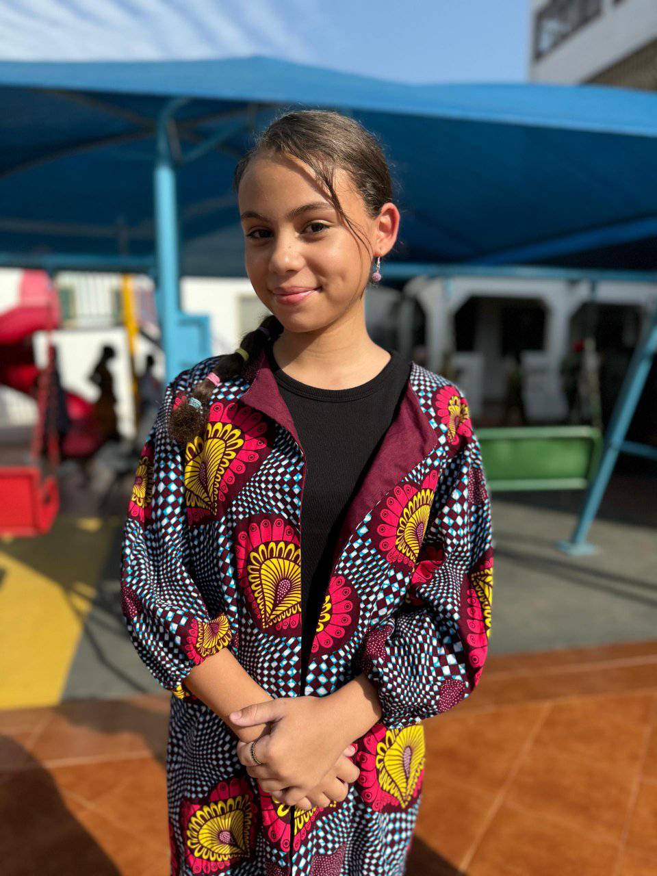 Confident student in colorful African print
