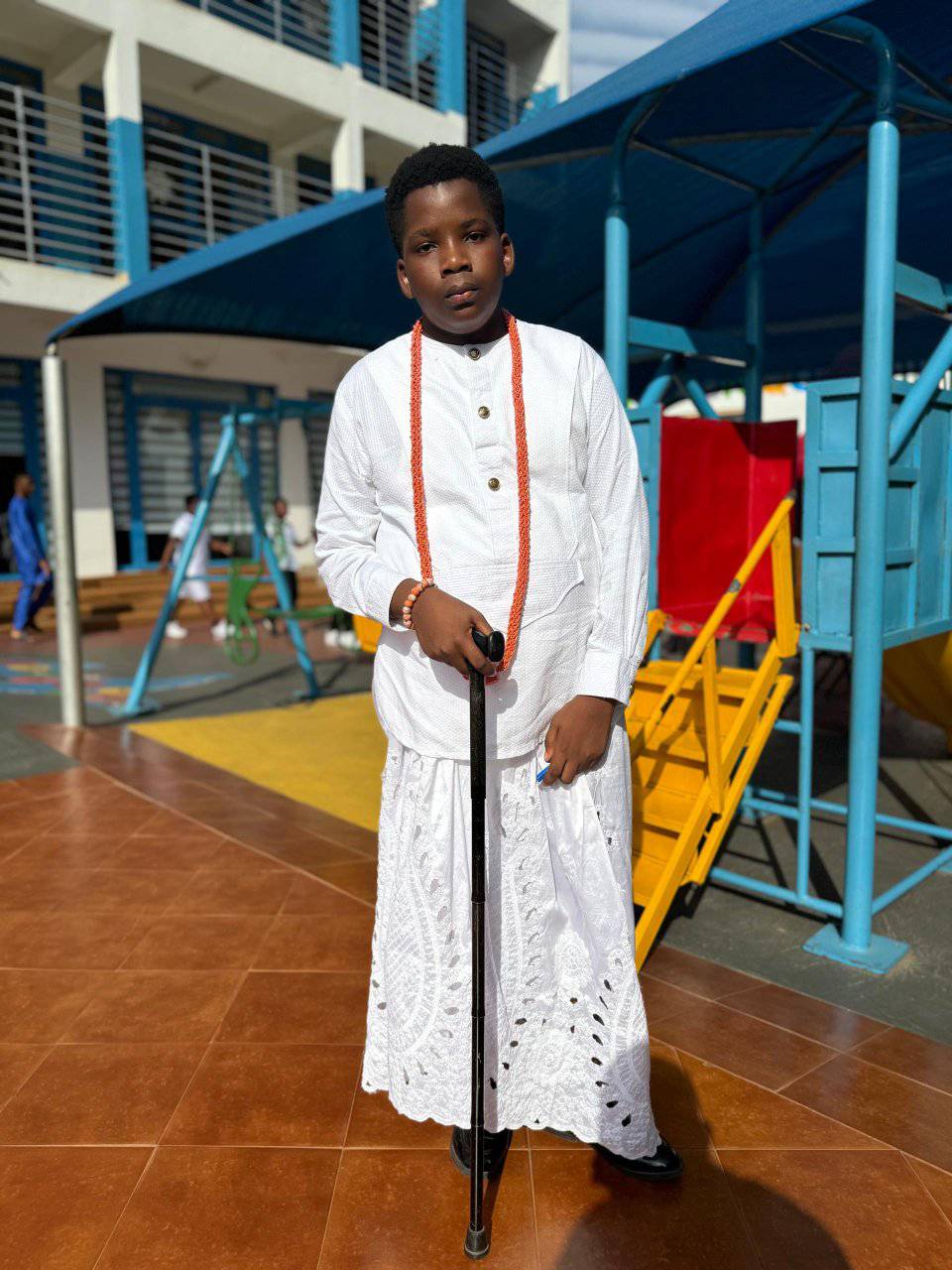 Student in traditional white attire